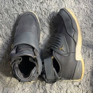 Jordan Black and Gold High-Top Sneakers
